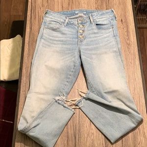 Light wash button fly skinny jeans